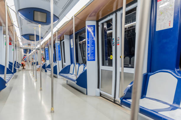 Madrid Metro Madrid, Spain - June 24, 2017: Quiet times inside of a Madrid subway train. The Madrid Metro is a subway system serving the city of Madrid, capital of Spain. The system is the 7th longest subway in the world. contemporary madrid european culture travel destinations stock pictures, royalty-free photos & images