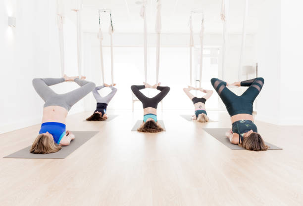 istock Women doing aerial yoga exercises 813194882