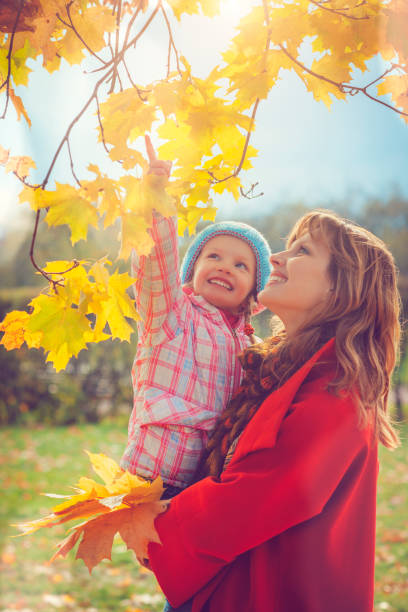 istock Mother with child outdoors in autumn 813198532