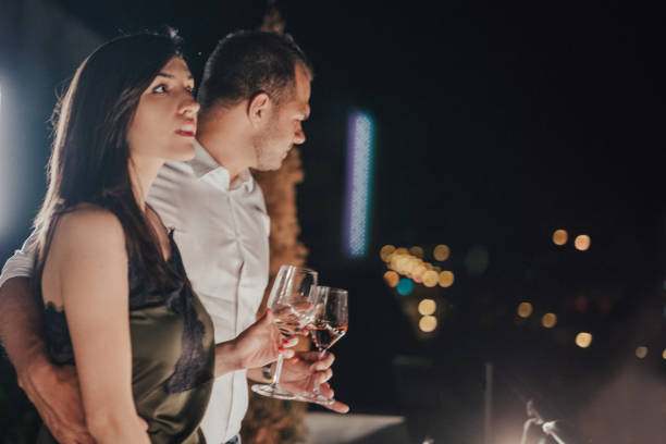 istock A romantic couple have a date on a balcony 813198634