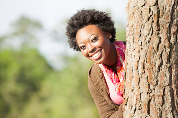 istock One African descent woman outdoors in park. 813199084