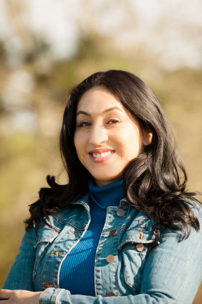 istock One Latin descent woman outdoors in park. 813201682