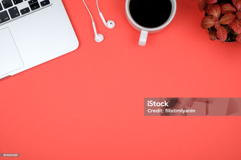 Red office desk table with computer. Top view with copy space Desk Stock Photo