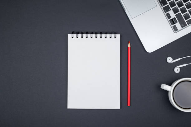 istock Minimal working desk with laptop and blank notepad page. Top view, flat lay and copy space 813204990