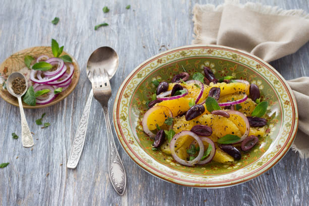 istock Plate with moroccan salad from oranges on a wooden table 813208338