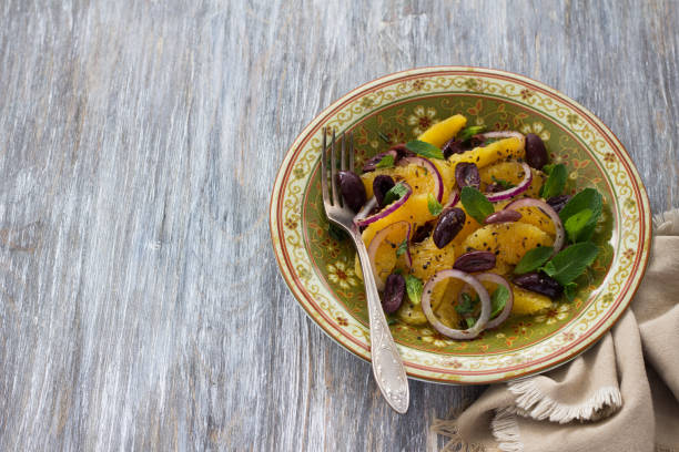 istock Plate with moroccan salad from oranges on a wooden table 813210628