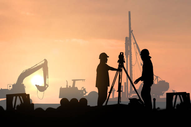 istock silhouette survey engineer in construction site use theodolite mark a concrete pile co ordinate 813211030
