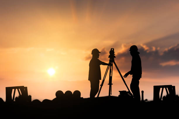 istock silhouette survey engineer in construction site use theodolite mark a concrete pile co ordinate 813211048
