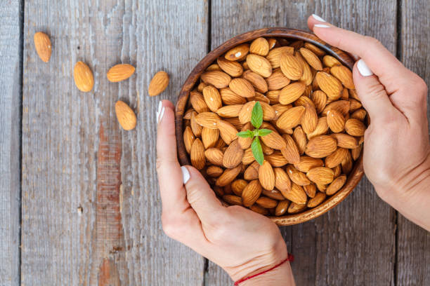 istock Raw almond nut in a wooden bowl 813213954