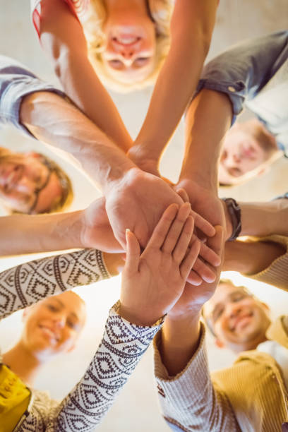 istock Happy business team joining their hands 813216284