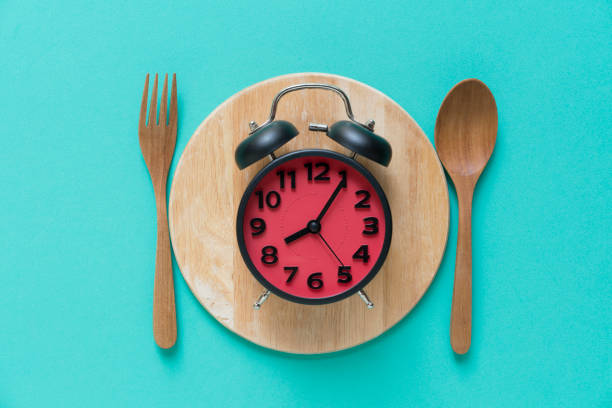 istock Meal time with alarm clock at breakfast time 813224422