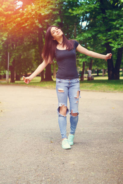 istock Young woman texting and taking selfie on smart phone 813225260