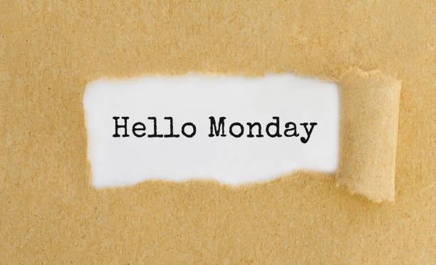 istock Text Hello Monday appearing behind ripped brown paper 813228656