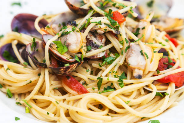 istock spagetti with vongole clams on plate close up 813229466