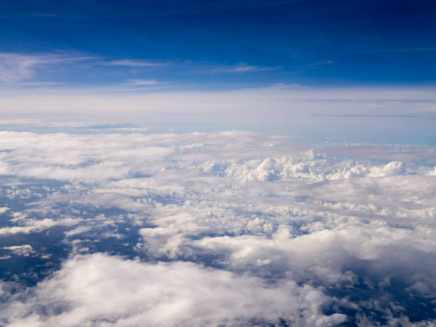 istock Cool soft unique white cloud and blue sky view from window of airplane while flying over Thailand. 813239362