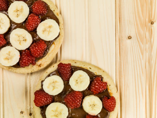 istock Pancakes with Chocolate Spread With Banana and Raspberries 813239796