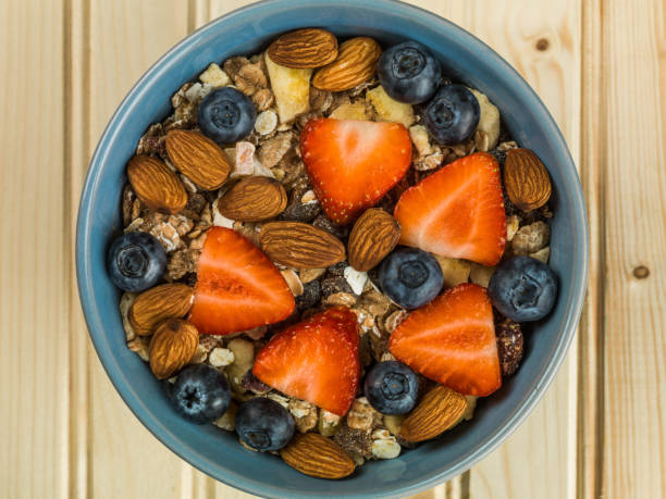 Muesli Breakfast Cereals With Strawberries and Blueberries Fruit
