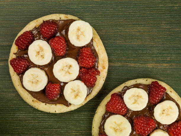 istock Pancakes with Chocolate Spread With Banana and Raspberries 813239812