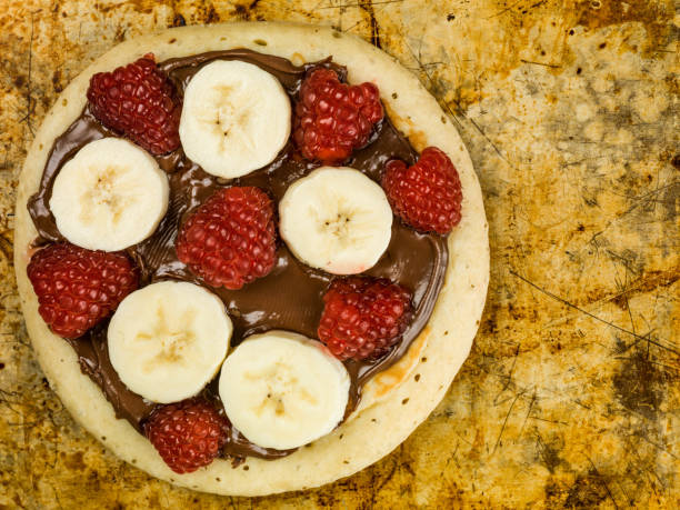 istock Pancakes with Chocolate Spread With Banana and Raspberries 813239822
