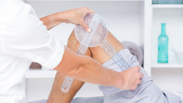 istock Doctor examining man leg with tool 813245852