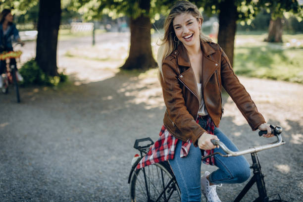 istock Hipster girl on bike 813245978