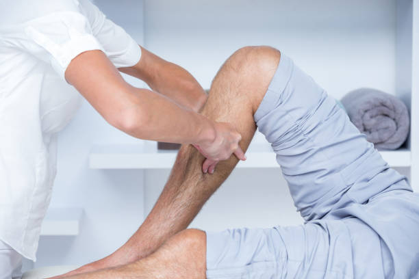 istock Physiotherapist doing calf massage to her patient 813246380