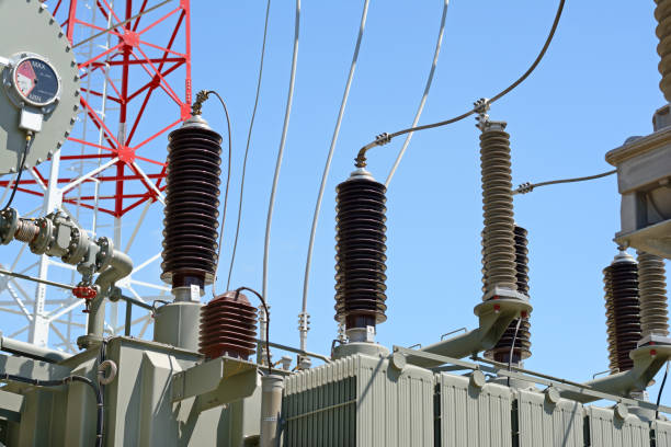 istock High voltage transformer and telecommunication pylon in electric power station 813246816