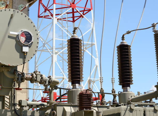 istock High voltage transformer and telecommunication pylon in electric power station 813246894