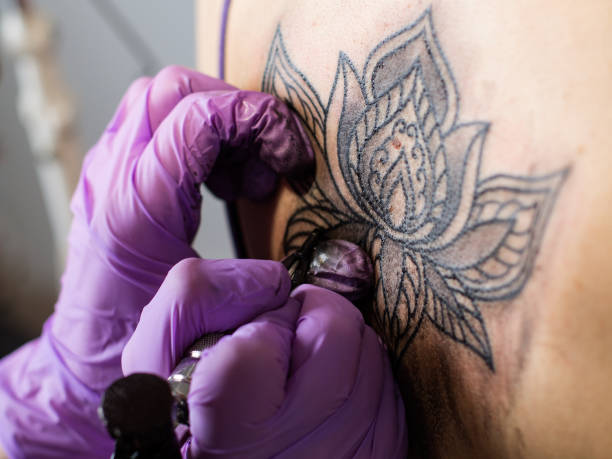 istock tattoo flower on the woman's back 813246976