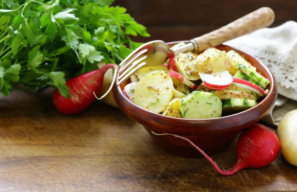 istock Potato salad with radish and cucumber, mustard dressing 813246986