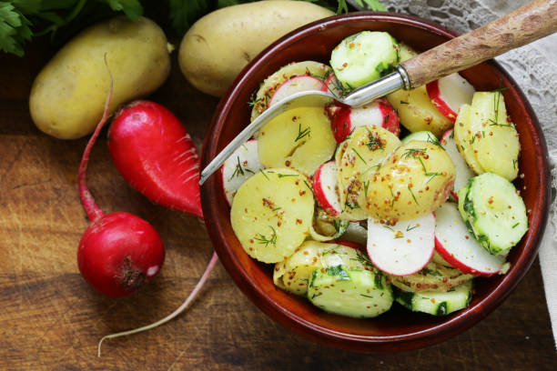 istock Potato salad with radish and cucumber, mustard dressing 813253334