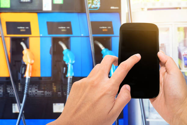 Mobile phone with blur image of gas station