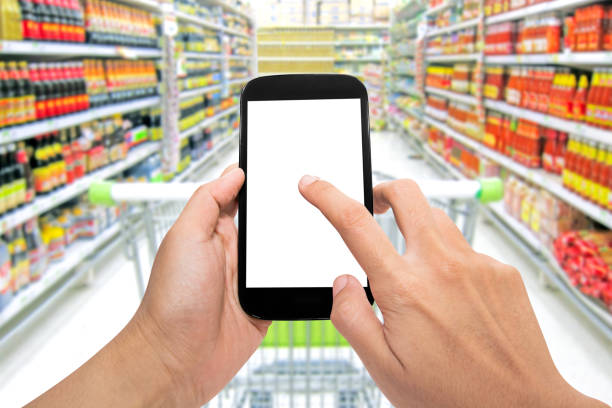 istock Man use mobile phone, blur image of inside supermarket 813256818