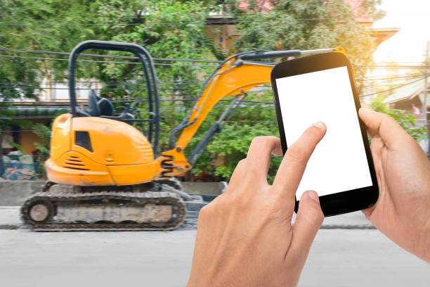 istock Hand holding smartphone and internet of things technology with trucks 813256894