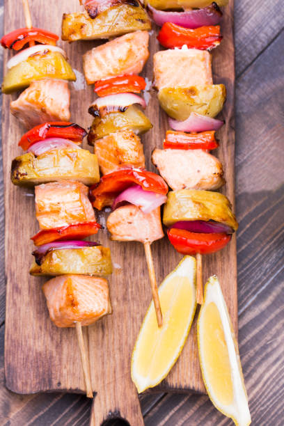 istock Grilled salmon and vegetables on skewers. 813257566