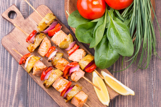 istock Grilled salmon and vegetables on skewers. 813257574