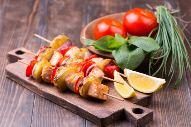 istock Grilled salmon and vegetables on skewers. 813257576