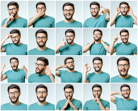 Set of young man's portraits with different emotions and gestures isolated