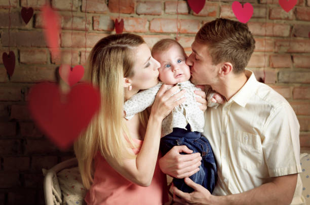 istock Young happy family with their infant boy 813276494
