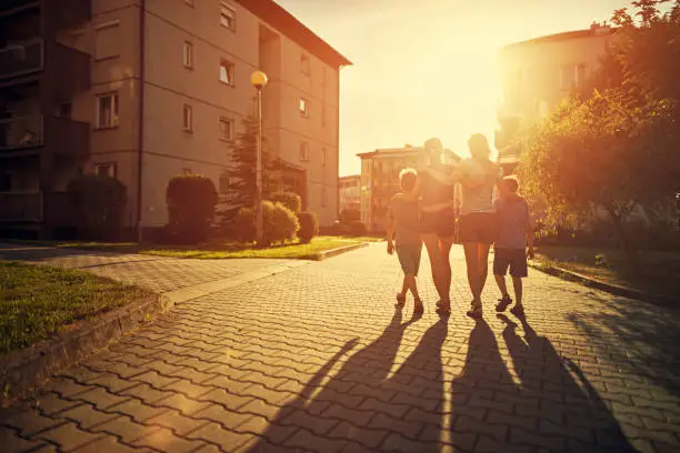 Photo of Family walking in urban area