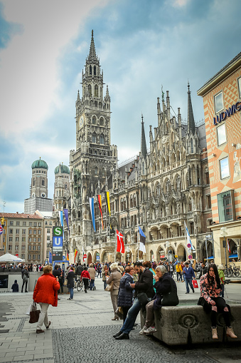 Munich, Germany - May 9, 2017 : A large group of people at Marienplatz with New Town Hall in the background in Munich, Germany.