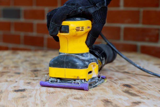 istock Home improvement handyman sanding wood in workshop 813303568