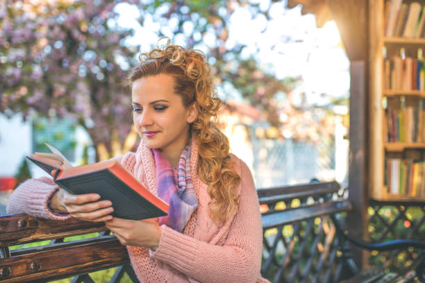 istock Woman enjoy with book in backyard 813303800