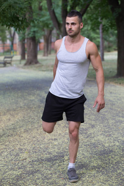 istock Young male jogger  doing workout outdoors in park 813303864