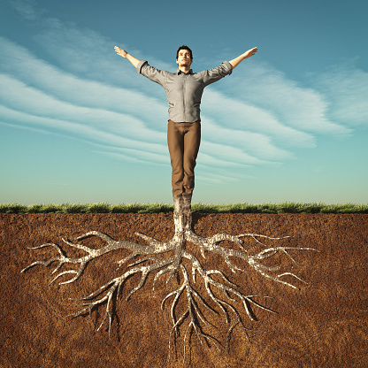 Image of a man that has taken root in the ground. This is a 3d render illustration