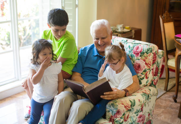 istock Reading a book with grandpa 813311402