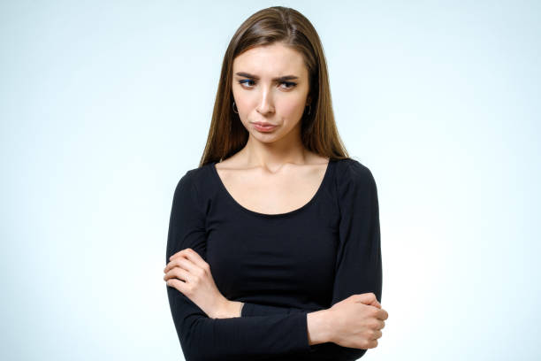 istock Young upset woman. Isolated on white background. Studio shot 813311726