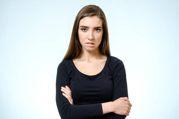 istock Young upset woman. Isolated on white background. Studio shot 813311740