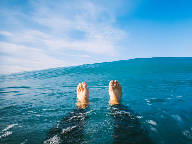 istock Blue wave in ocean with sky and man surfer is relaxed. 813317118