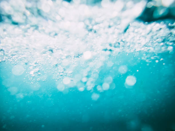 istock Underwater wave in sea and bokeh. Water bubbles texture in ocean 813317148